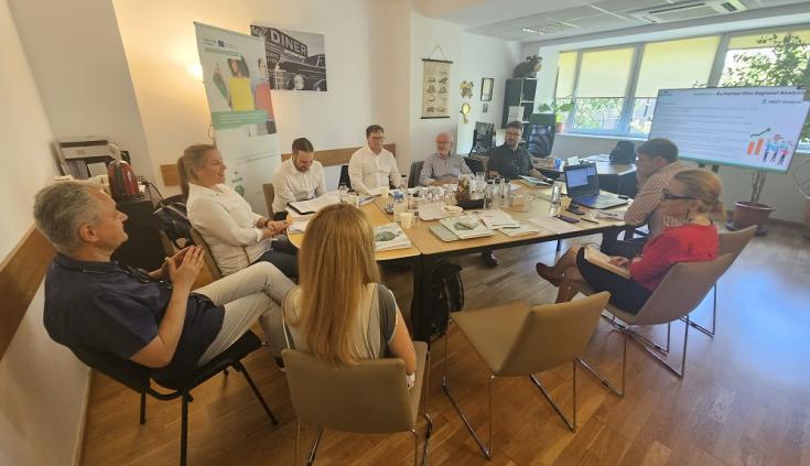 People in discussion around a table 