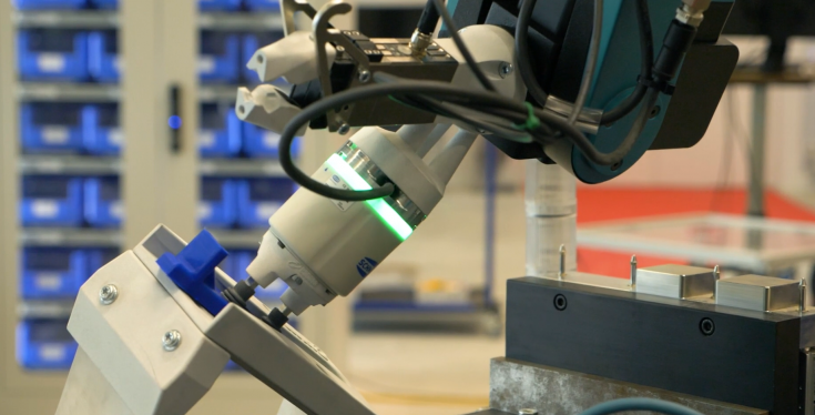 Robot arm interacting with a device