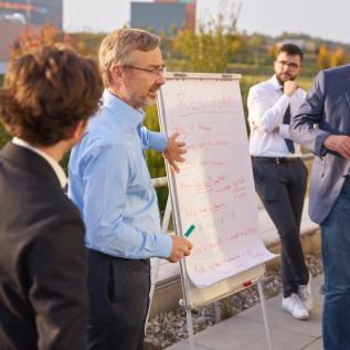 People presenting outside