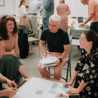 People speaking around a table People speaking around a table