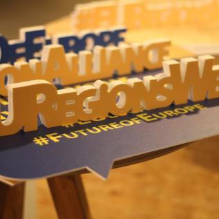 EU Regions Week hashtags Three hashtags of EU Regions Week and the Future of Europe on a table
