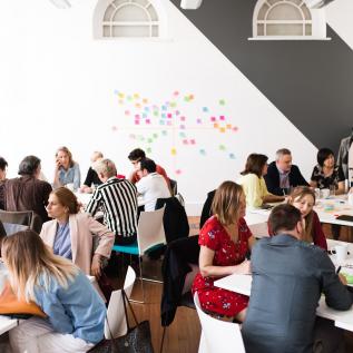 People working in groups on post-its