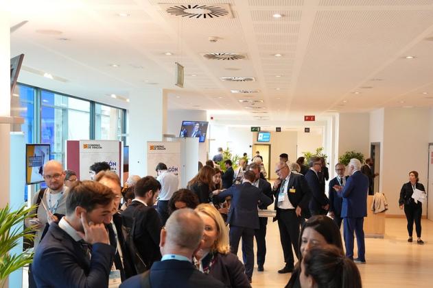 Stand - EURegionsWeek 2024 People gather near stands
