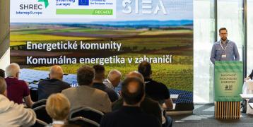 A man (Stanislav from SIEA) standing at the desk presenting Energy Communities