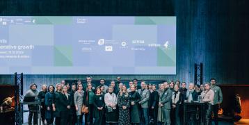 Training programme participants on stage at the closing event of the programme.