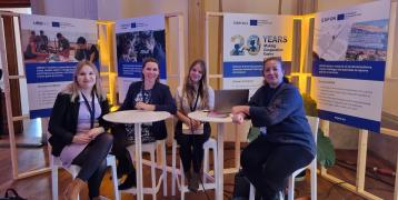 group of people at an exhibition stand