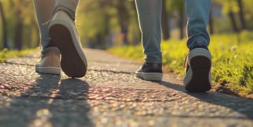 Close up of shoes from two people walking