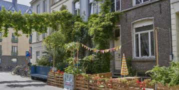 Street in Ghent with facade garden and garlands