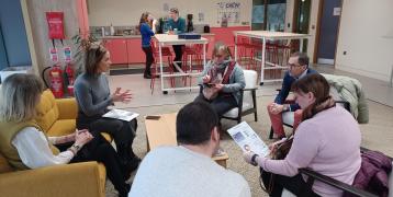 people sitting in a hub open area
