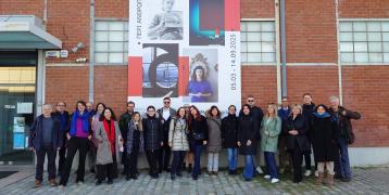 people posing infront of museum