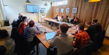 Group of people sitting in a conference room
