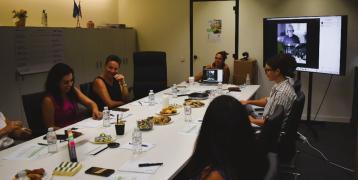 People at long table in a meeting