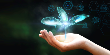 A human hand holds a digital, glowing sprout surrounded by small icons on a trustworthy AI.