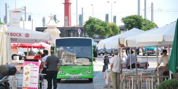 Bus driving through street