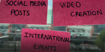 Post-its on a window with words related to digital communication