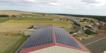 Solar panels located on the roof of an agricultural warehouse, in La Serna, Palencia