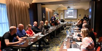 People meeting in a big conference room