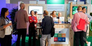 people at an exhibition stand