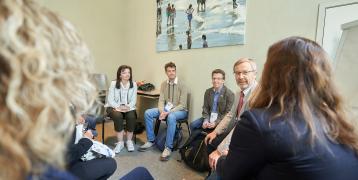 Group of people sitting in a circle