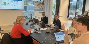 Stakeholders sitting at the table and discussing