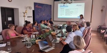 Regional Stakeholder Group meeting in Veszprem Hungary. Group of people sitting at table watching presentation