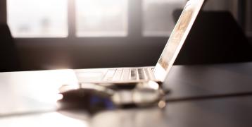 Laptop and mouse on desk