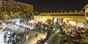 night view of an outdoor space filled with young people