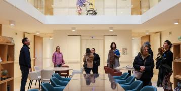 Partners below, elderly person walking on the top level in Residential Care Home