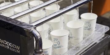 Reusable caps filled with tap water during running events