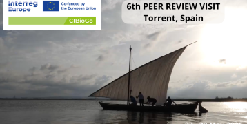 6th Peer Review Visit I see 4 people on a boat as well as the CIBioGo logo and 2 texts