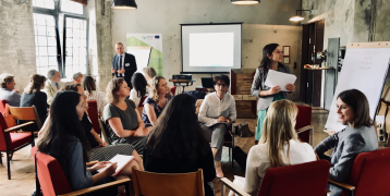 People sitting and listening to presentation