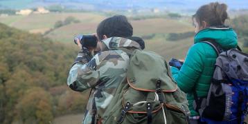 People taking pictures of a landscape