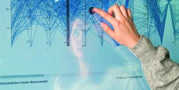 Person drawing on digital board