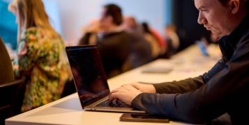 Person typing on a laptop