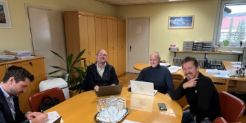 Participants of the 5th stakeholder seminar of ORZ pictured sitting around a table at the premises of the Maribor Municipality
