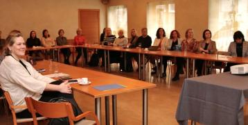 People sitting around a meeting table