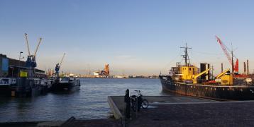 Shipyard with cranes in the background