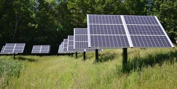 Solar panels in field of grass