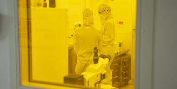 Two people standing in a lab