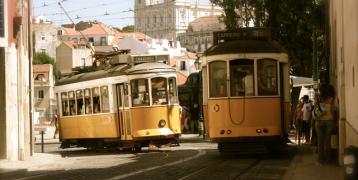 Two yellow trams in a city