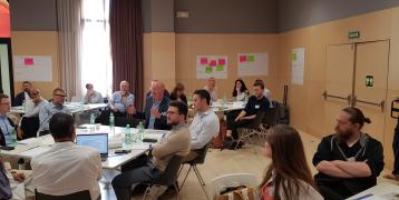 People sitting at the workshop.