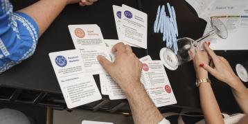 a hand handling cards