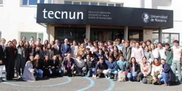 Group of people in front of the tecnun university sign