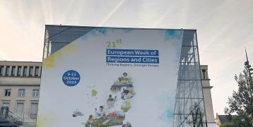 A large sign welcomes attendees to EU Week