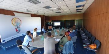 Stakeholders speaking about RECs at a round table