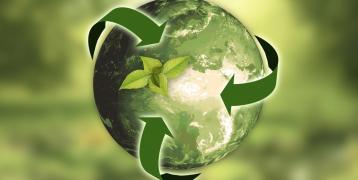 Illustrative picture. A globe surrounded by recycling logo arrows.