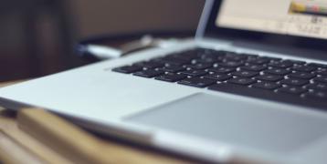 A laptop on a desk.