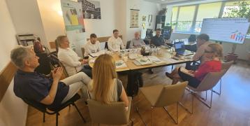 People in discussion around a table 